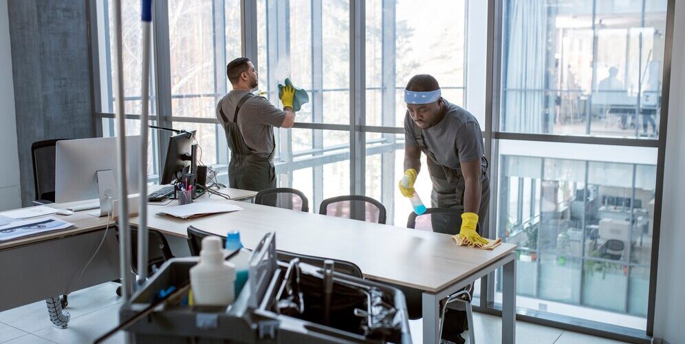 full-shot-men-cleaning-office_23-2149345516